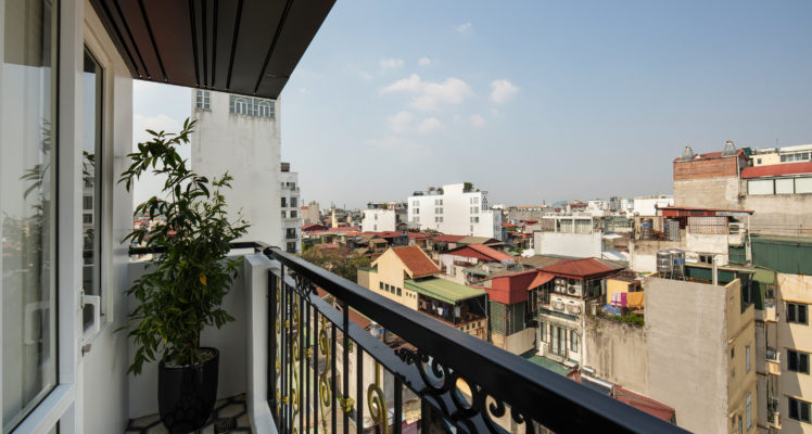 suite room with balcony hanoi city view